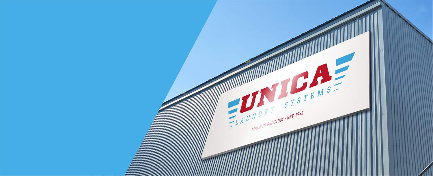 Das Unica-Gebäude in Merchtem mit dem Schild Unica Laundry Systems, made in Belgium, est. 1932